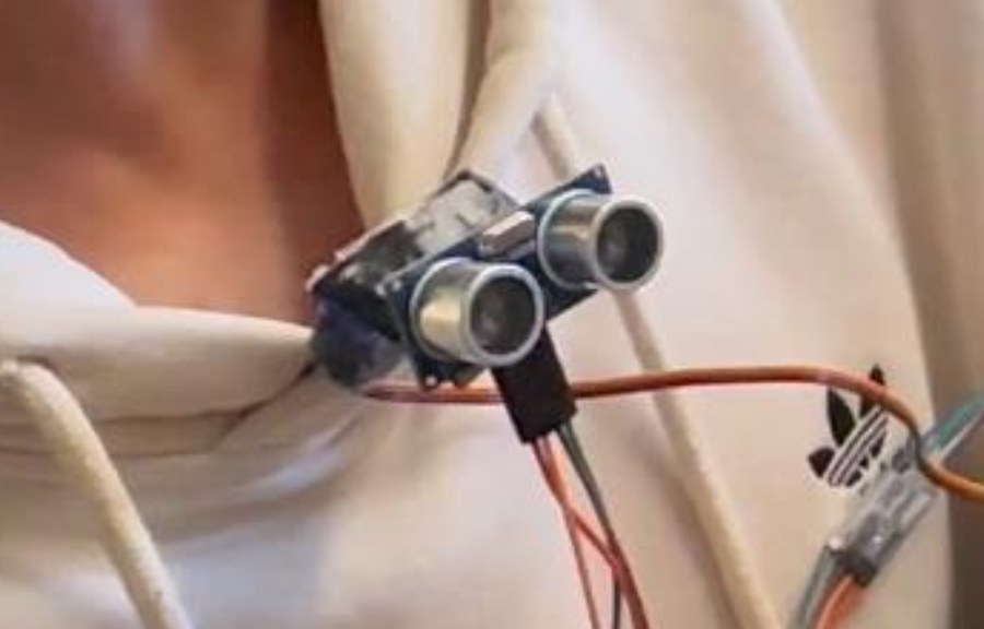 Ultrasonic distance sensor clipped to a hoodie